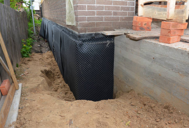 Happy homeowners after waterproofing job in Ingalls